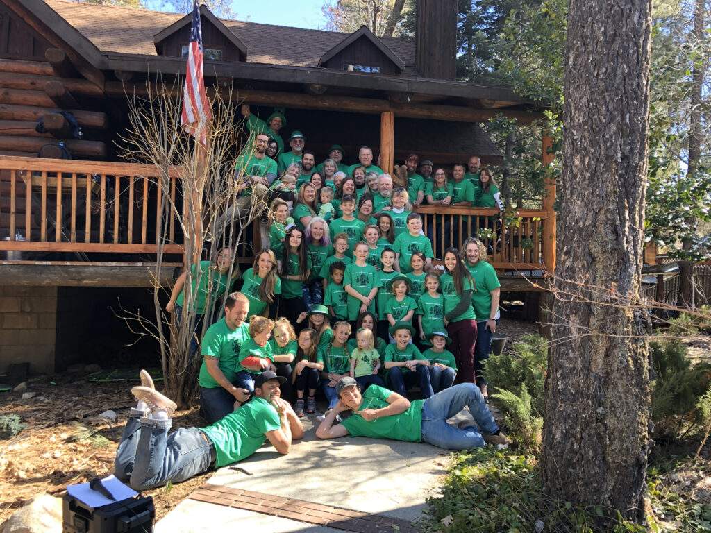 Erin’s extended Irish Family pose in front of her grandparent’s cabin