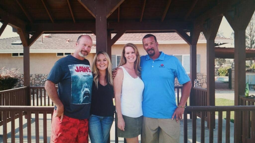 Erin poses with her two brother and sister